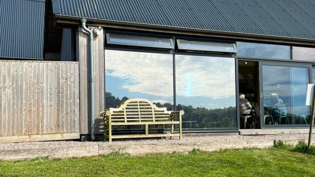 Applying Mirror Finish Window Film To External Glass Windows At Otter Valley Dairy.jpg